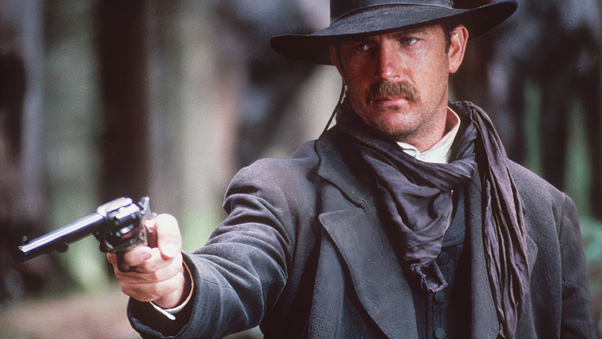 Wyatt aims a gun in Wyatt Earp