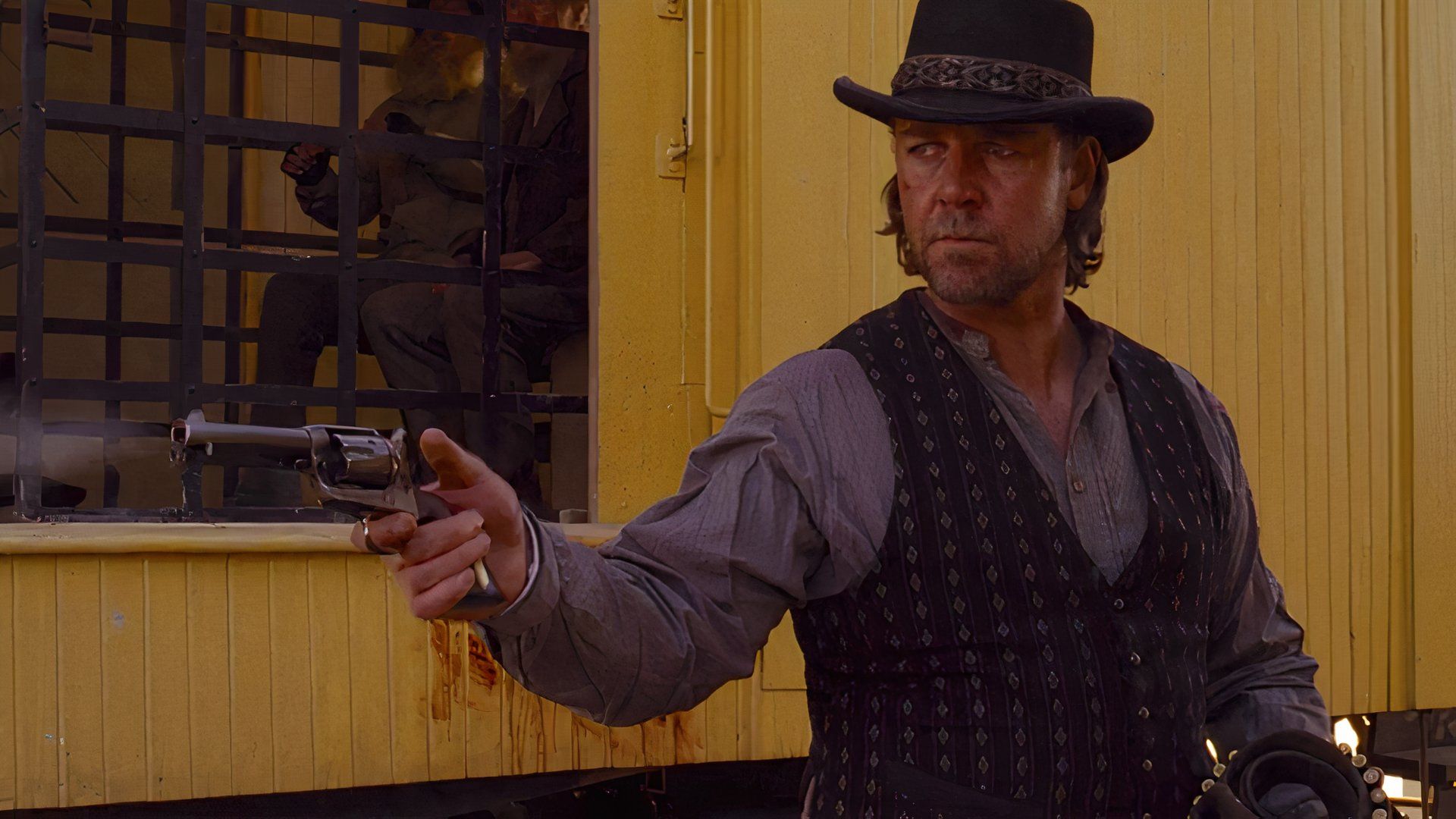 Wade points his gun at 3:10 to Yuma.