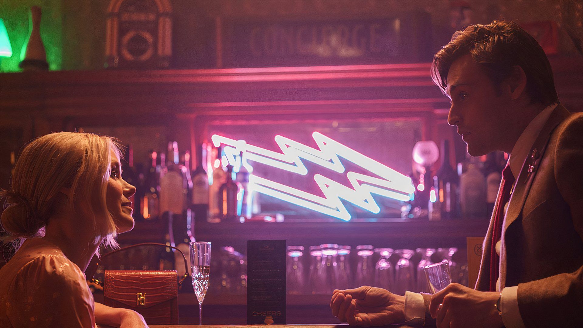 Alison Pill and Patrick J. Adams at a bar in the movie Young Werther at TIFF 2024