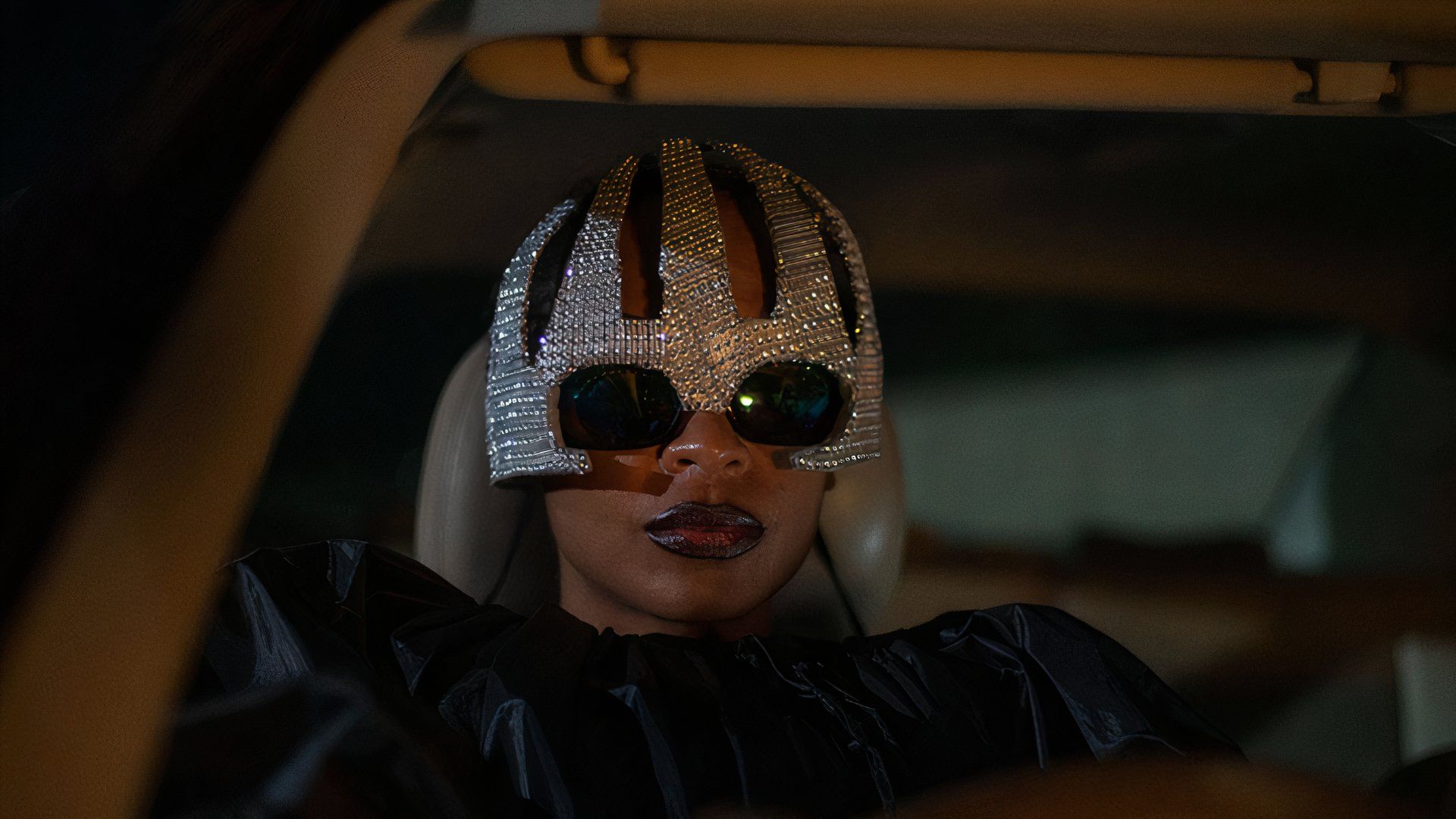 Black woman in a silver mask in On Becoming a Guinea Fowl movie at TIFF 2024