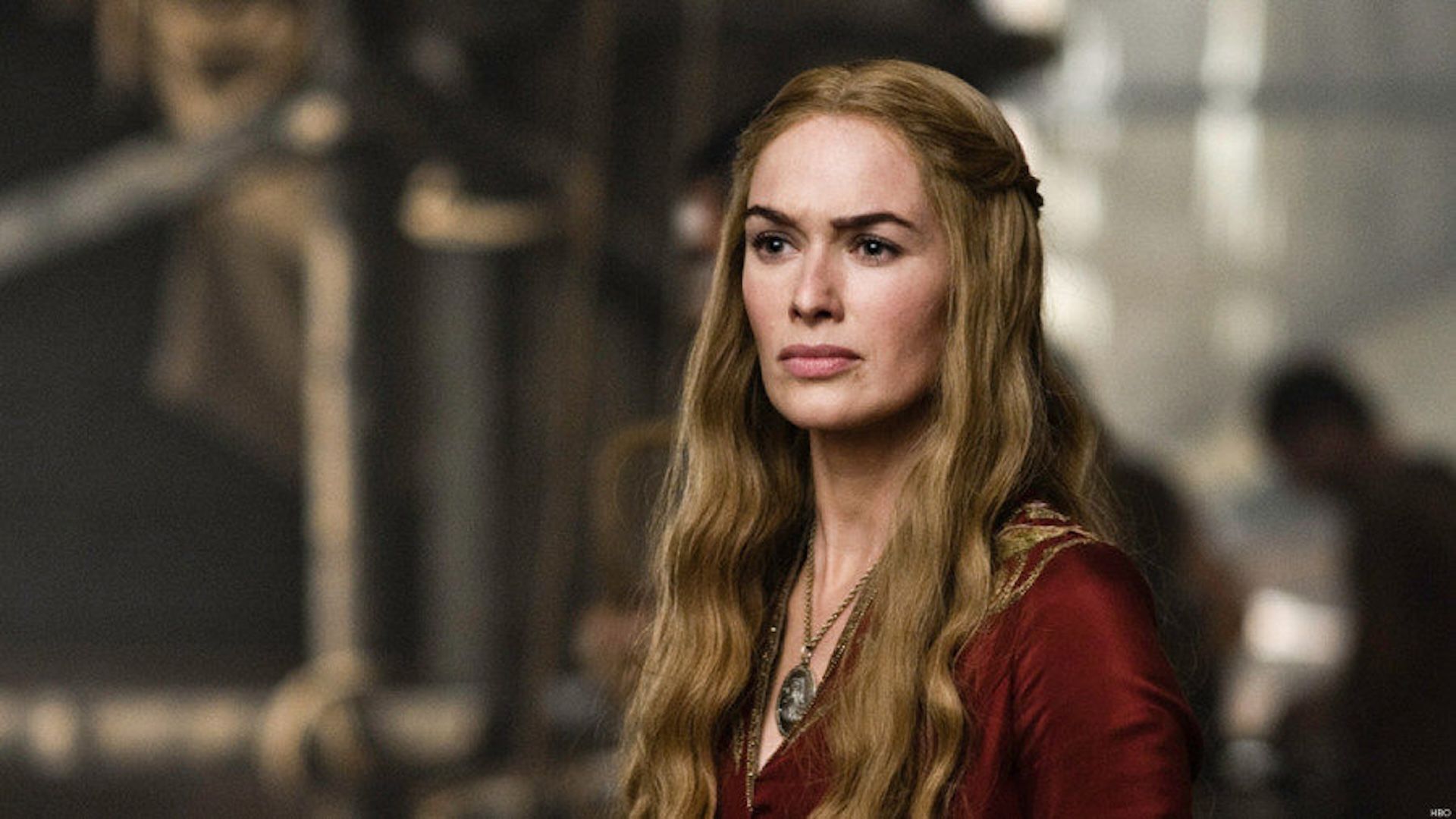 Cersei wearing a red dress with a confused look in Game of Thrones