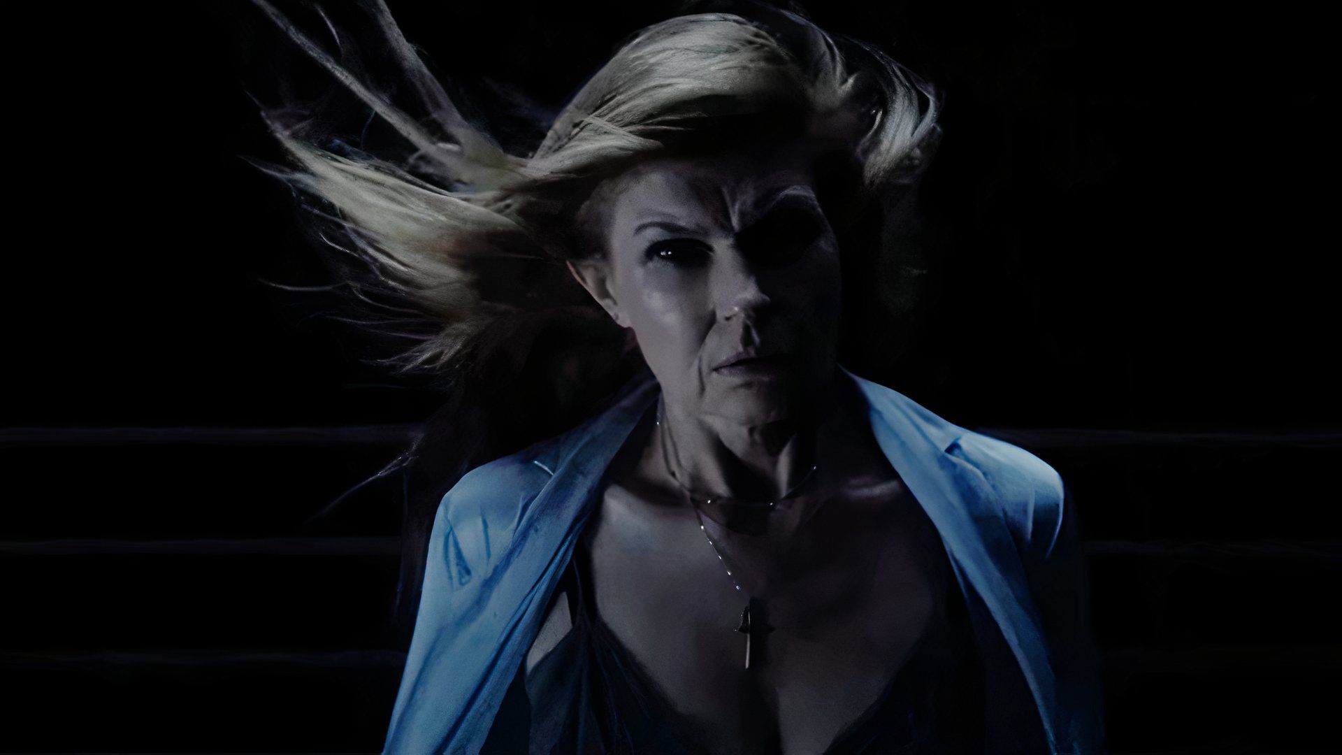 Connie Britton in the hairblown wind in the 2024 movie Here After