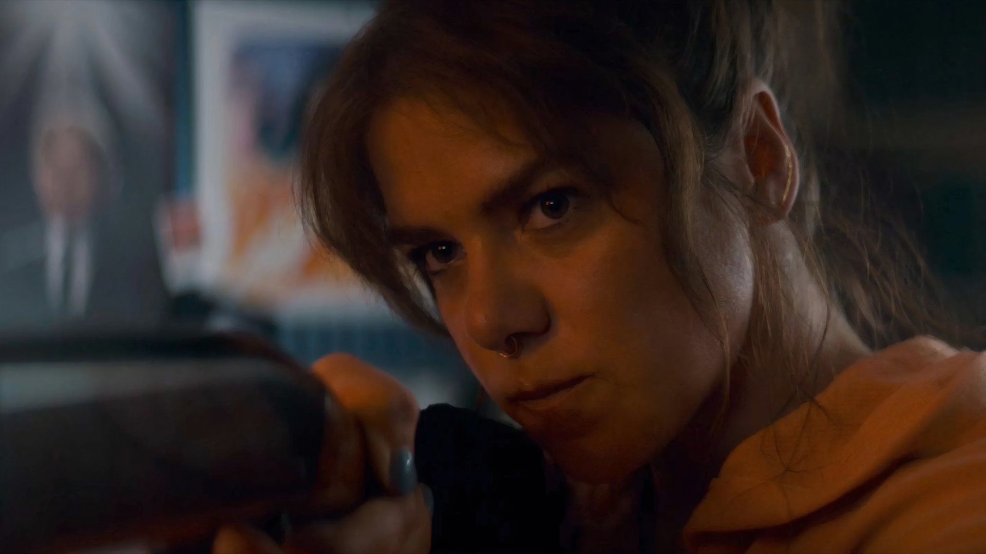 Kaniehtiio Horn points a gun in the movie Seeds at TIFF 2024