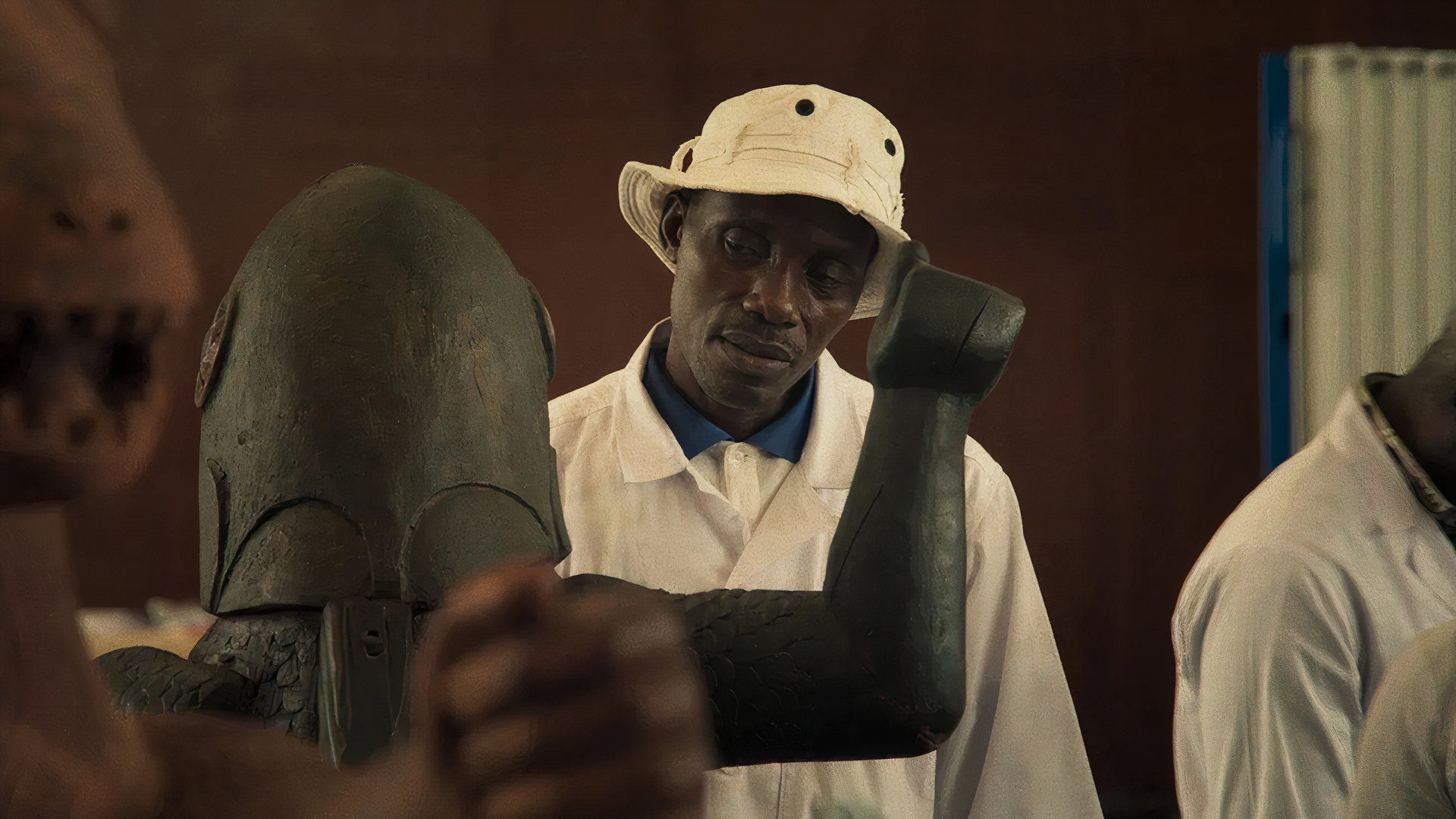 Man in a museum in Mati Diop movie Dahomey