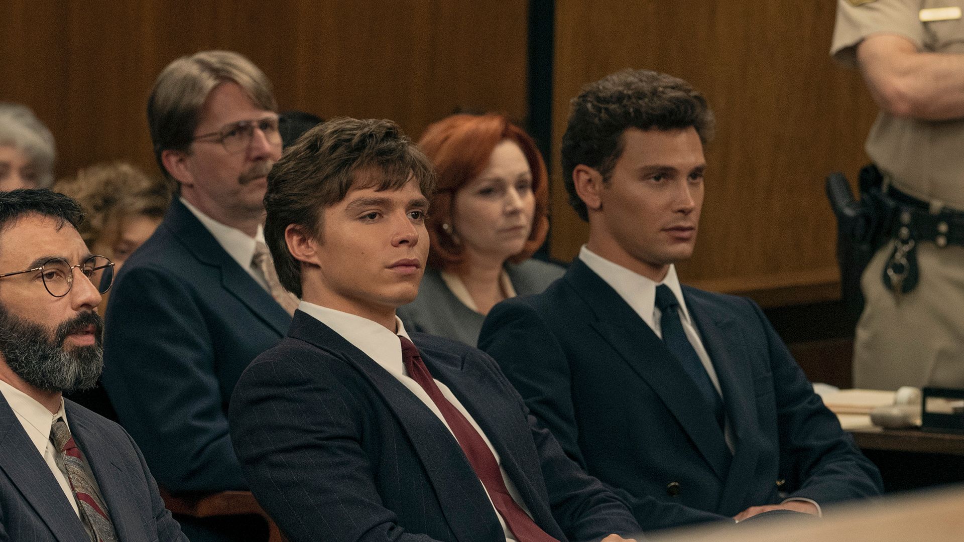 Lyle and Erik Menendez sitting in court in a scene from Monsters: The Lyle and Erik Menendez Story.