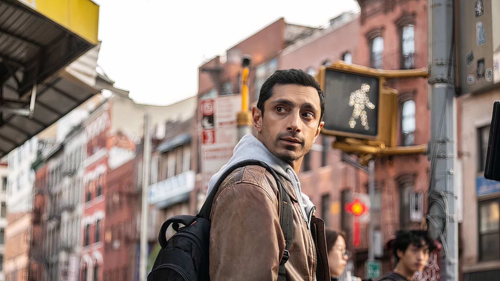 Riz Ahmed at a crosswalk in Relay at TIFF 2024