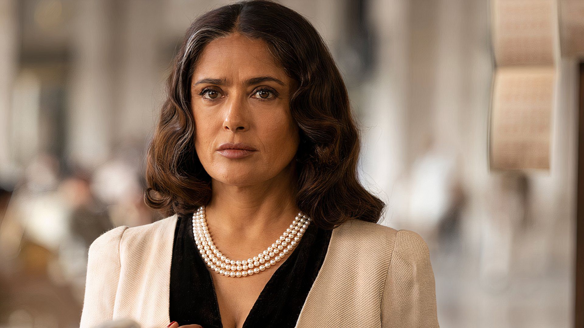 Salma Hayek in a white suit in Angelina Jolie's movie Without Blood at TIFF 2024