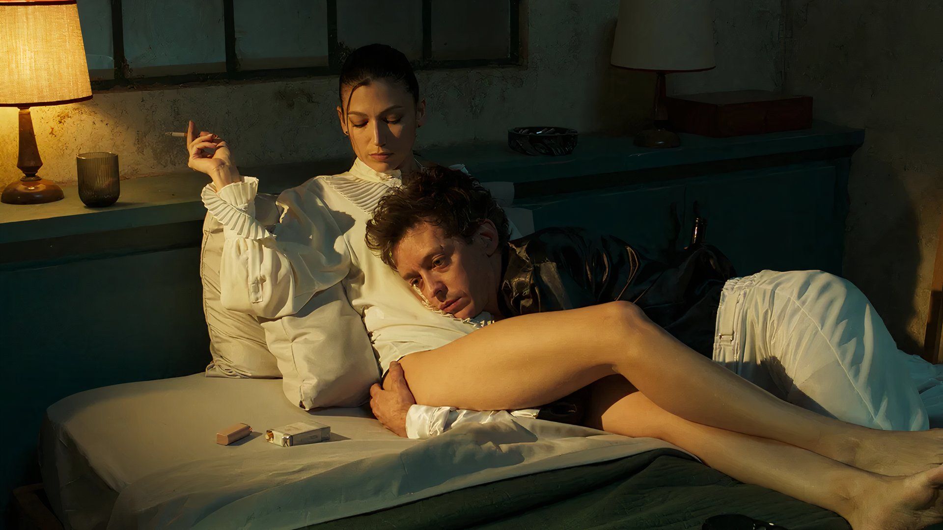 Two people smoke in bed in the movie Kill the Jockey in TIFF 2024