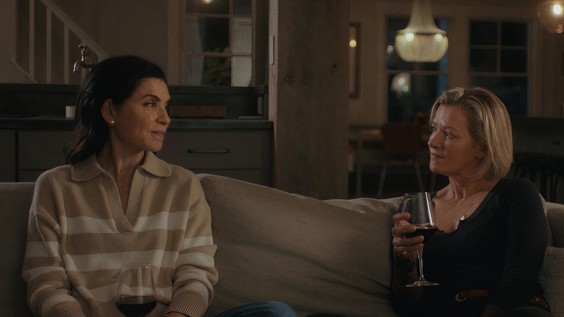 Two women on the couch in Millers in Marriage movie at TIFF 2024