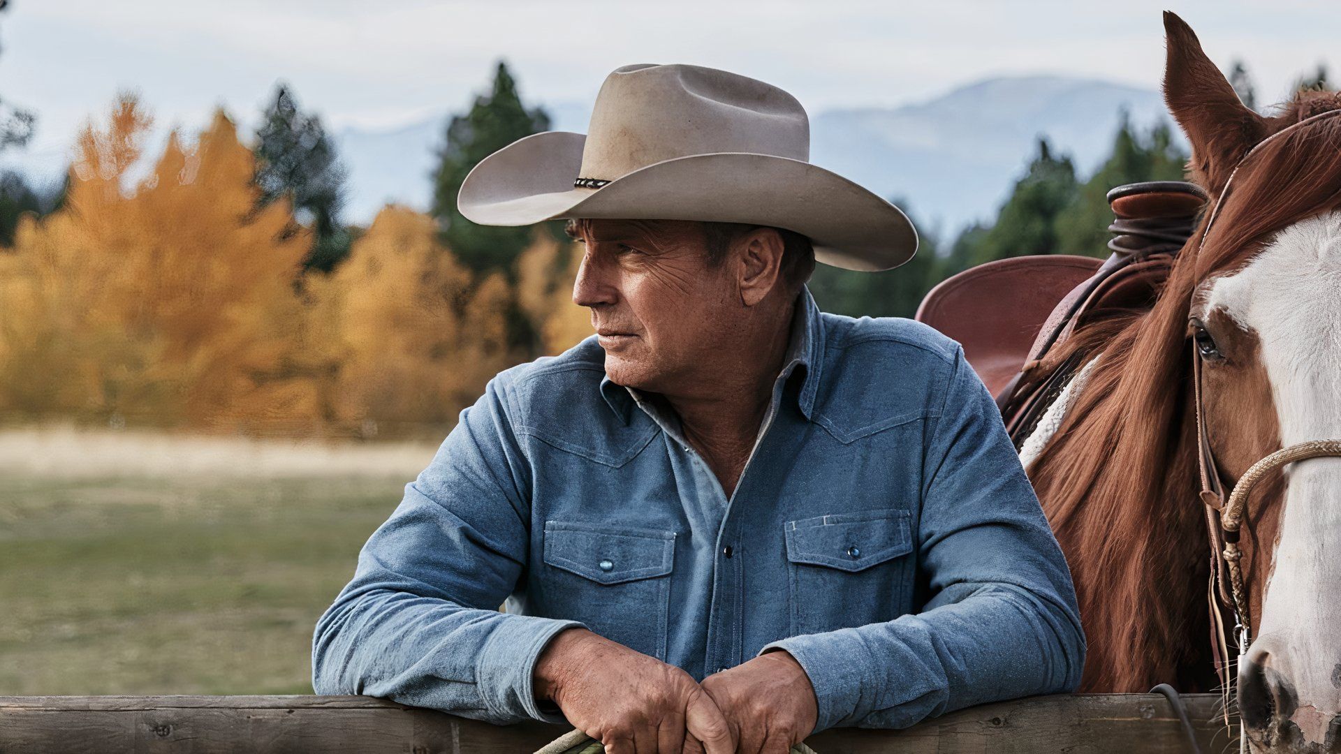 Kevin Costner as John Dutton stands by a horse in Yellowstone