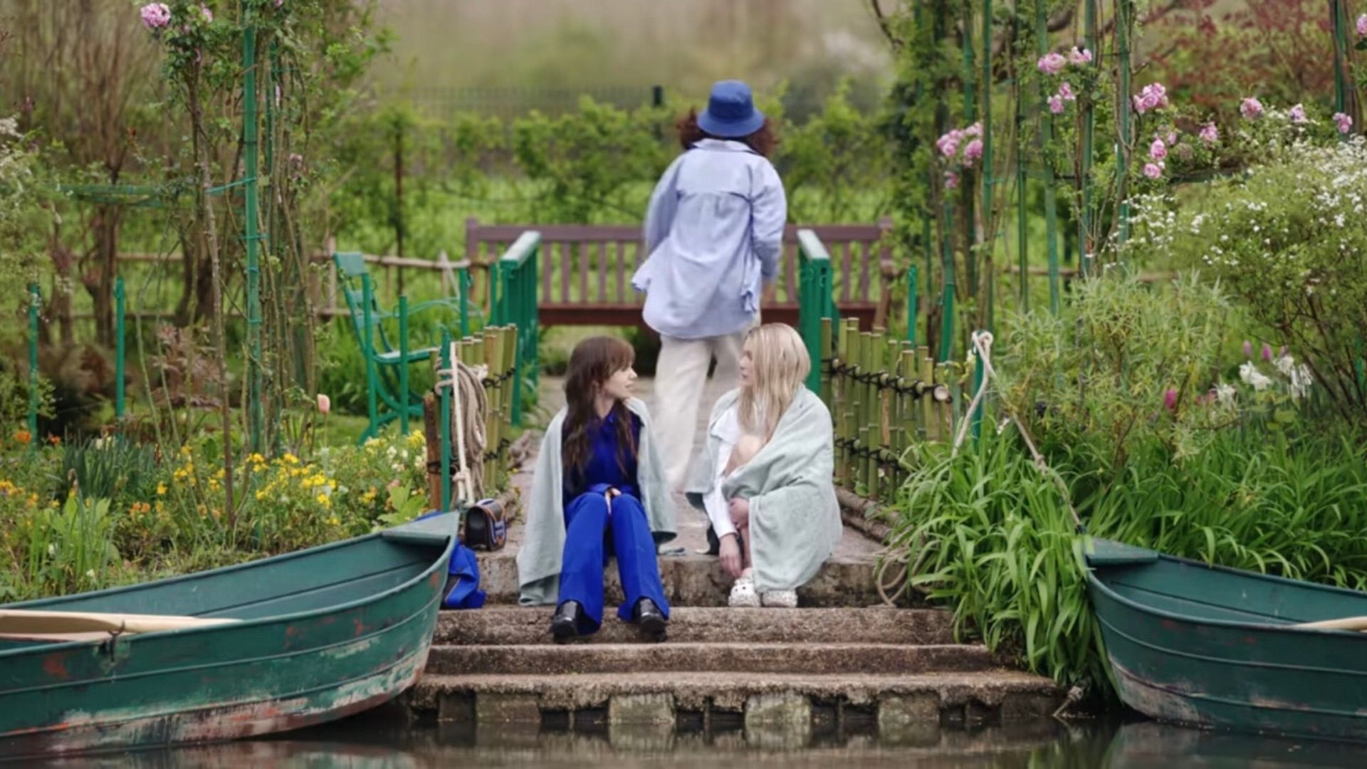 Emily and Camille, played by Lily Collins and Camille Émilie Razat, in the drama series Emily in Paris, Season 5 in Giverny