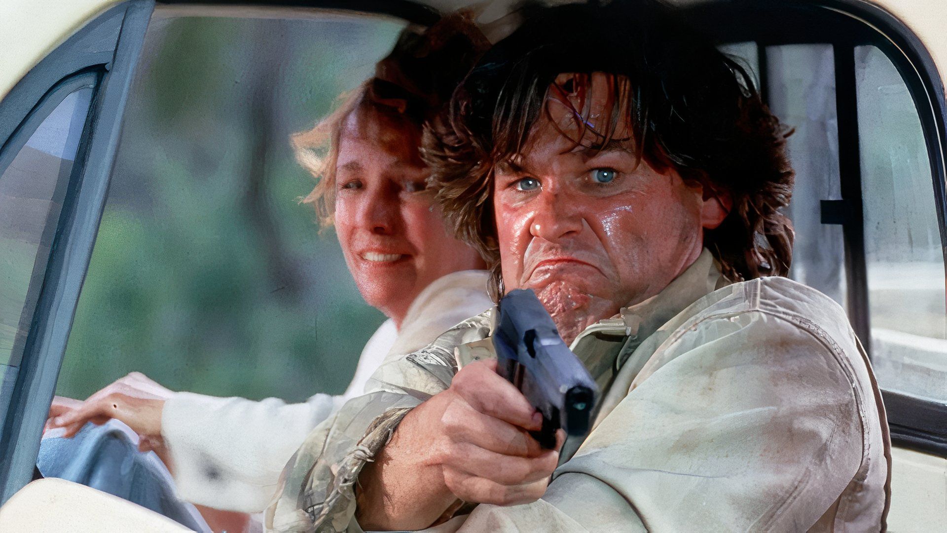 Kurt Russell with a gun in a car in the movie Breakdown