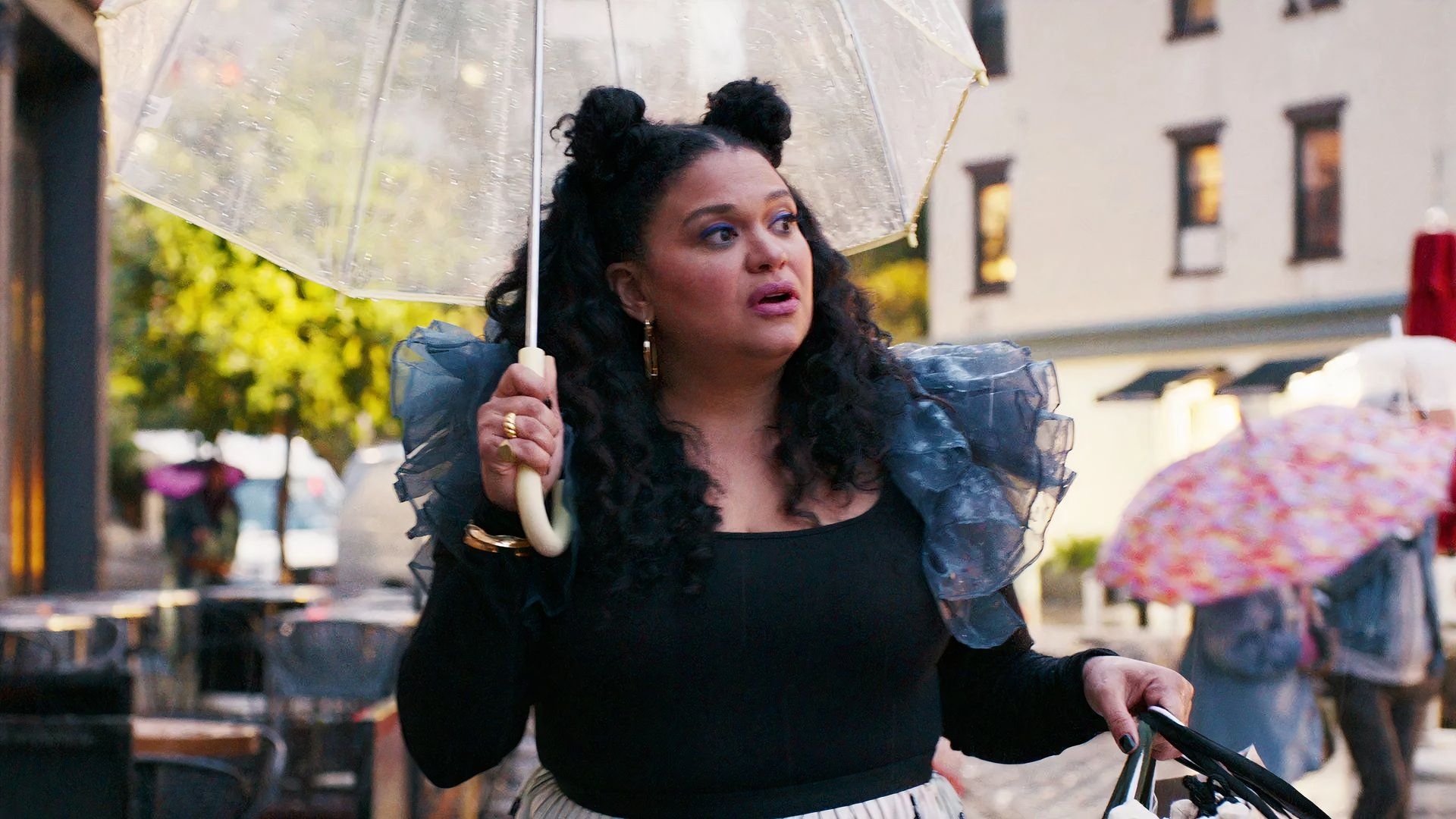 Michelle Buteau holding an umbrella on a sunny day, Survival Of The Fittest (1)