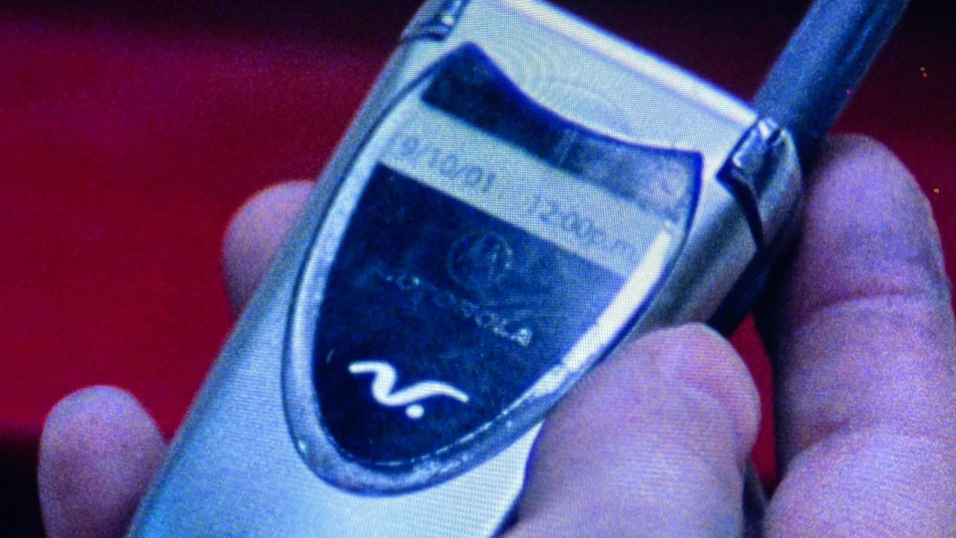 Close-up of cell phone showing Valley on September 10, 2001 in Saw (2004).