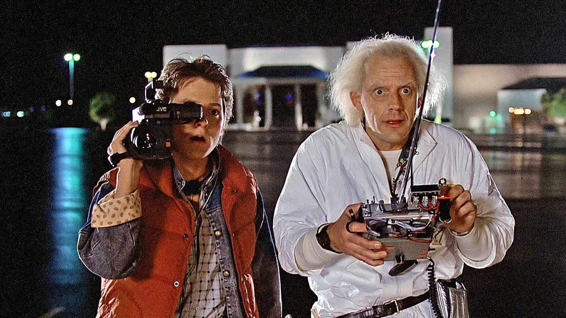 Marty filming and Doc using his machine, both wide-eyed in Back to the Future.