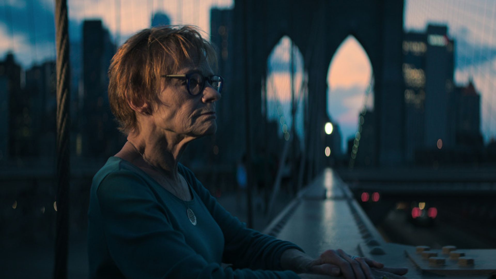 Carol stands on a bridge in The Manhattan Alien Abduction