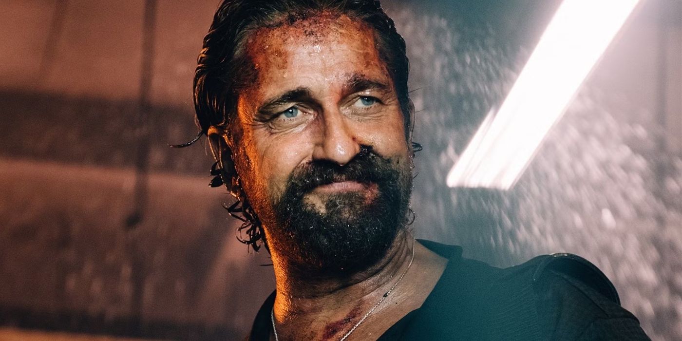 A dirty Gerard Butler smiles in Den of Thieves 2 Pantera