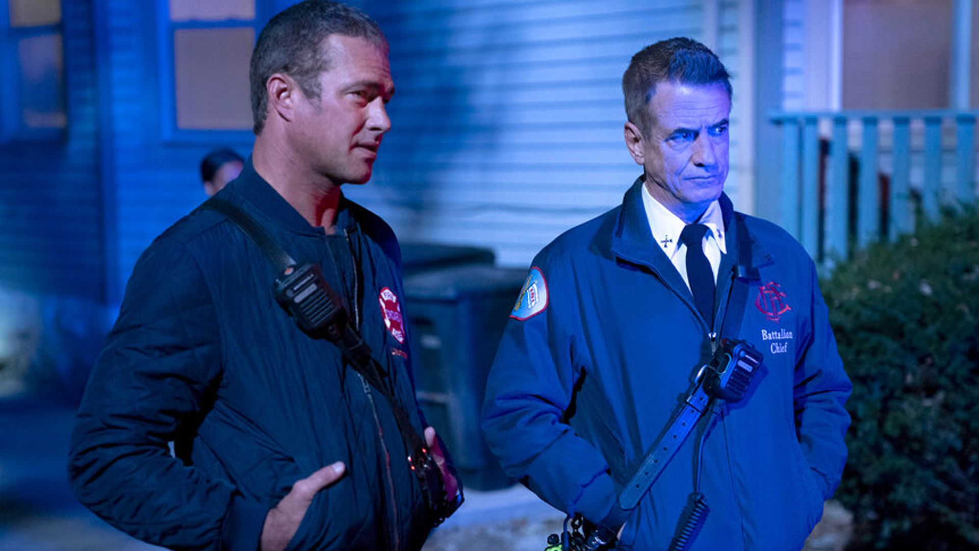 Dom and Kelly stand side by side in Chicago Fire