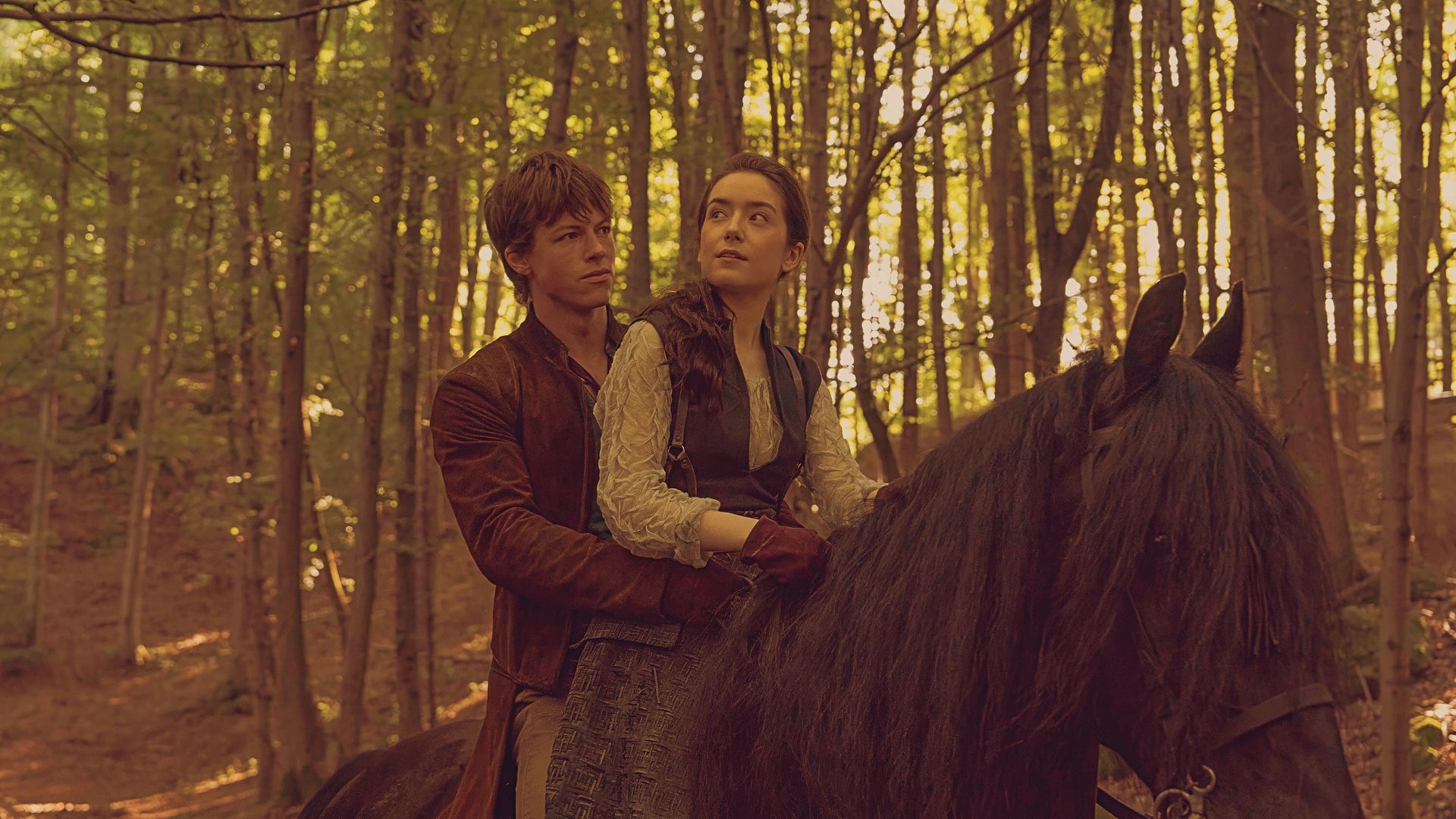 Milo Callaghan as Orry and Emma Canning as Tula on a black horse in Dune Prophecy Episode 3