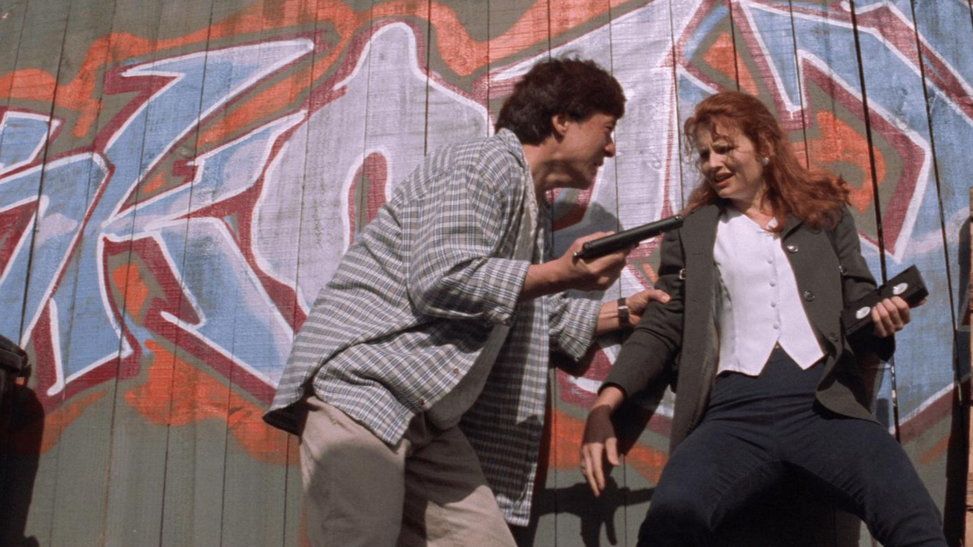 Jackie Chan as Jackie and Gabrielle Fitzpatrick as Diana in a still from 1997 action movie Mr. Nice Guy