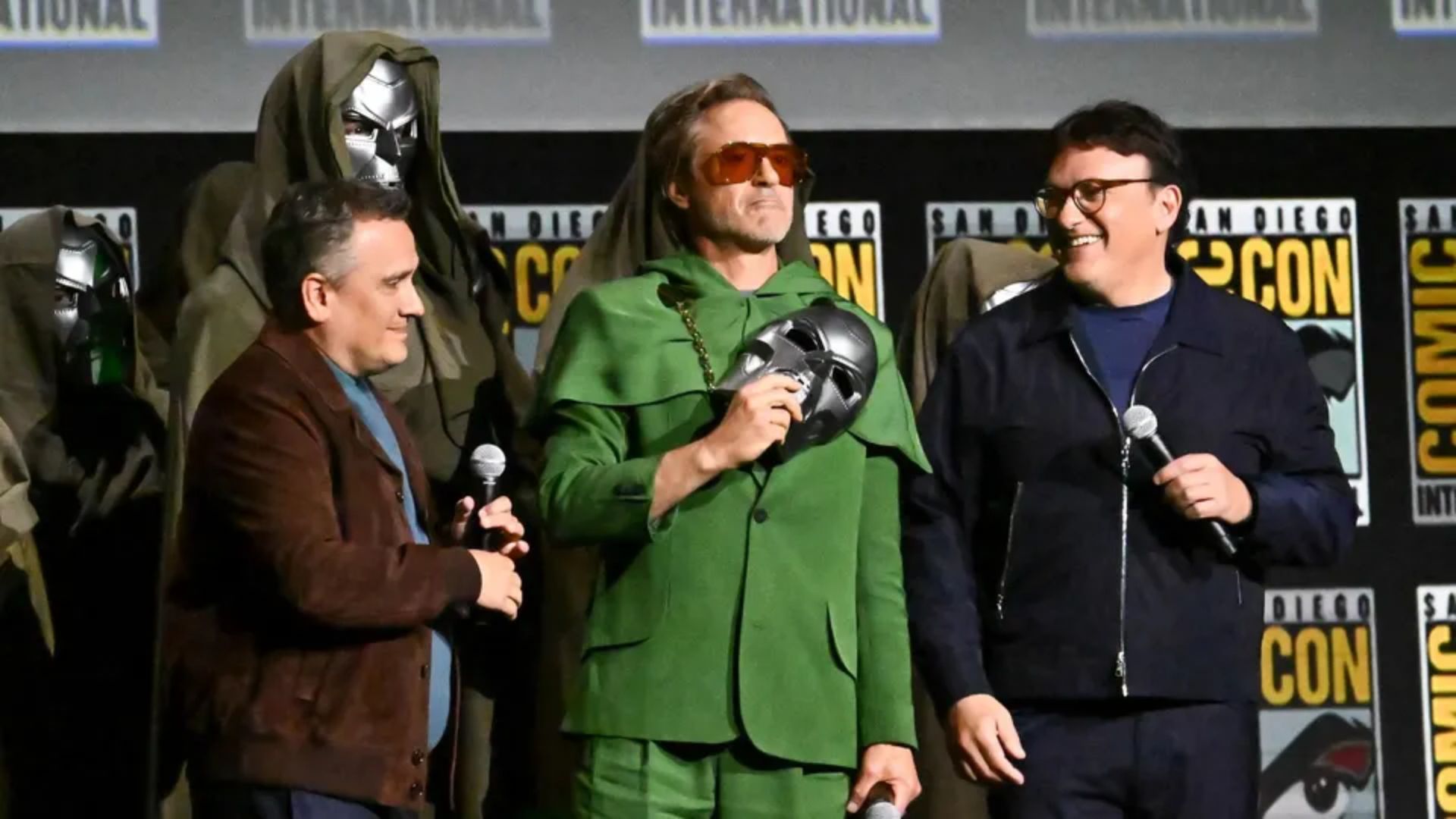 Robert Downey Jr. on stage with the Russo Brothers for Avengers: Doomsday at Comic Con