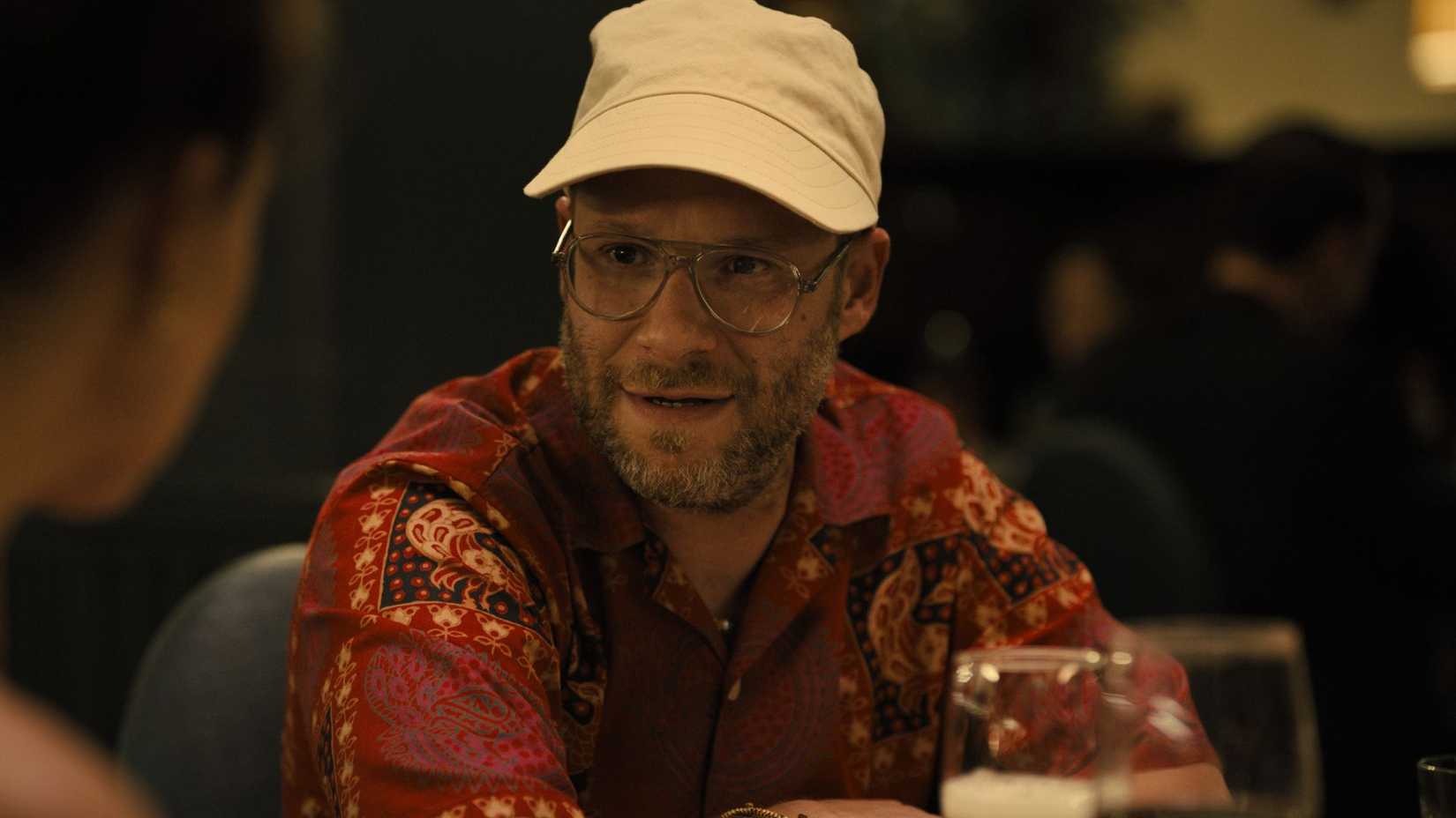 Seth Rogen in Platonic talking at a bar.