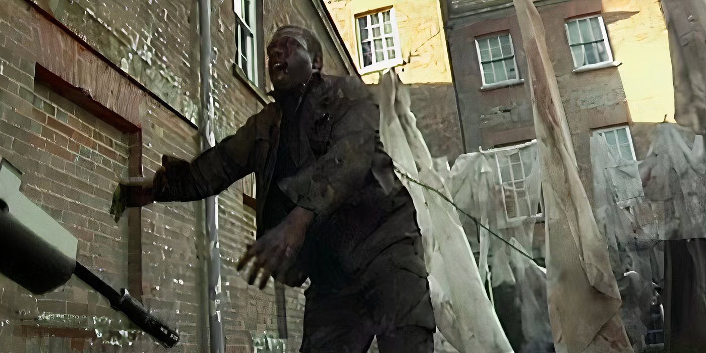 A still of a zombie attacking someone off camera in Danny Boyle's zombie horror film 28 Days Later.