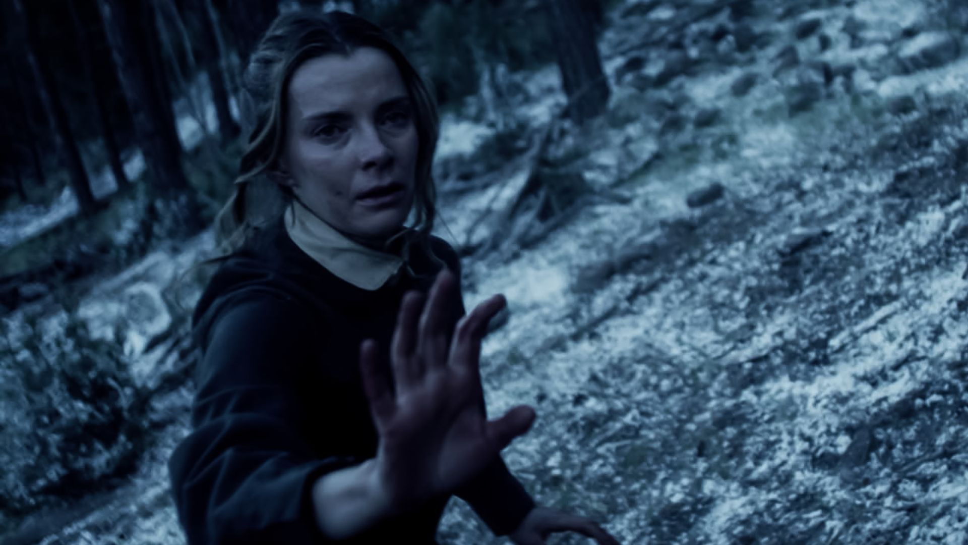 Betty Gilpin scared in the snow in the Netflix Western series American Primeval