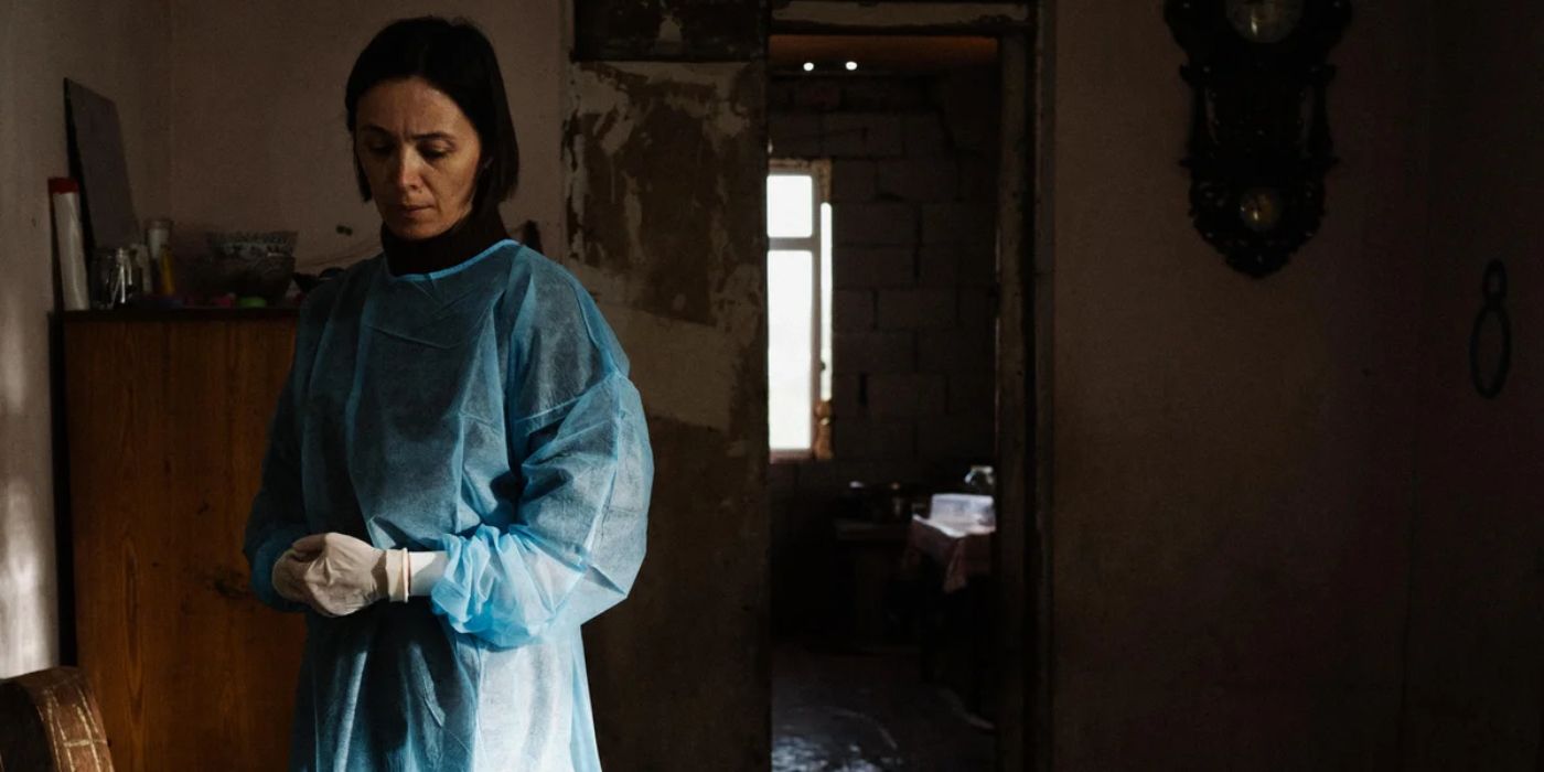 Ia Sukhitashvili as Nina in a hospital gown in the 2025 movie April at Sundance