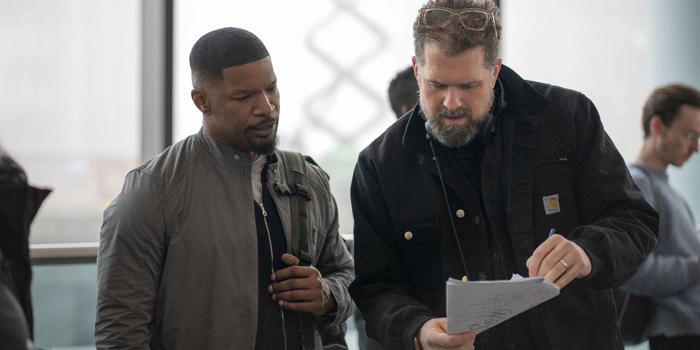 Jamie Foxx and director Seth Green look at paper behind the scenes of Back in Action on Netflix