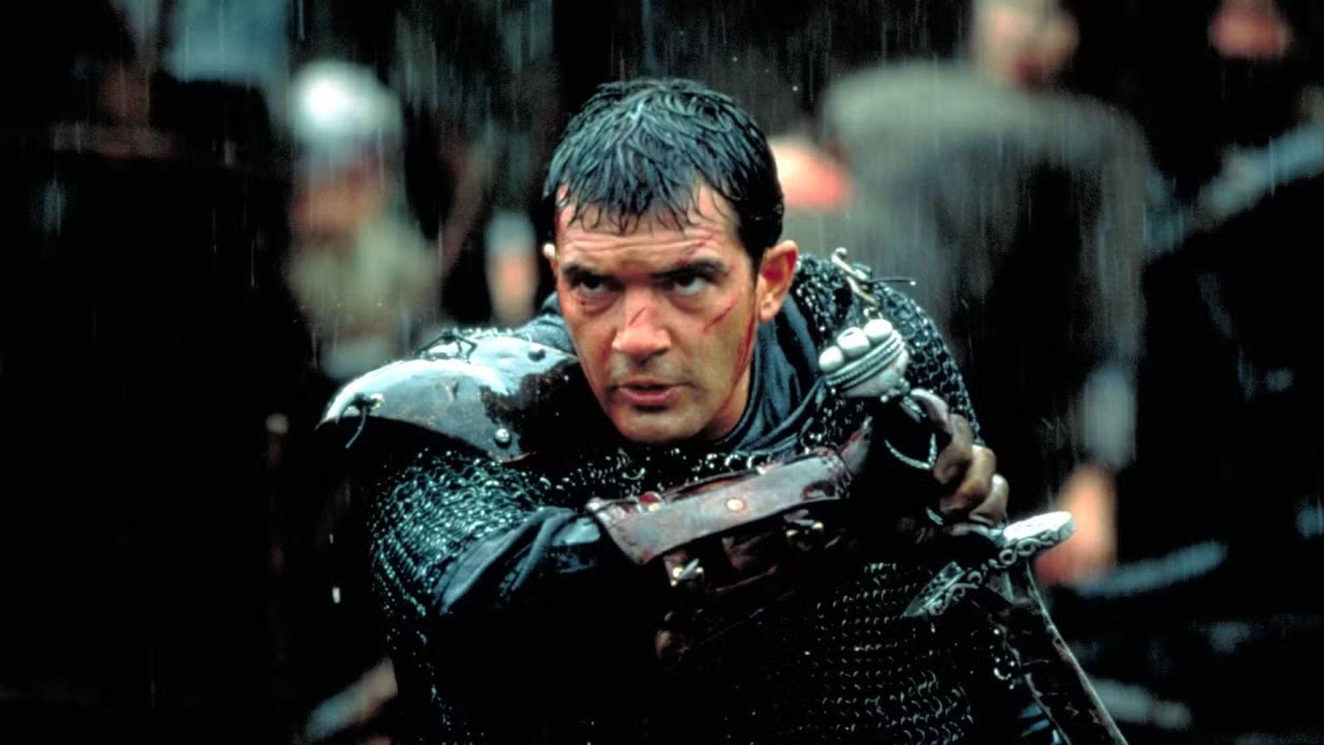 Fadlan pulls a sword in the rain in The 13th Warrior