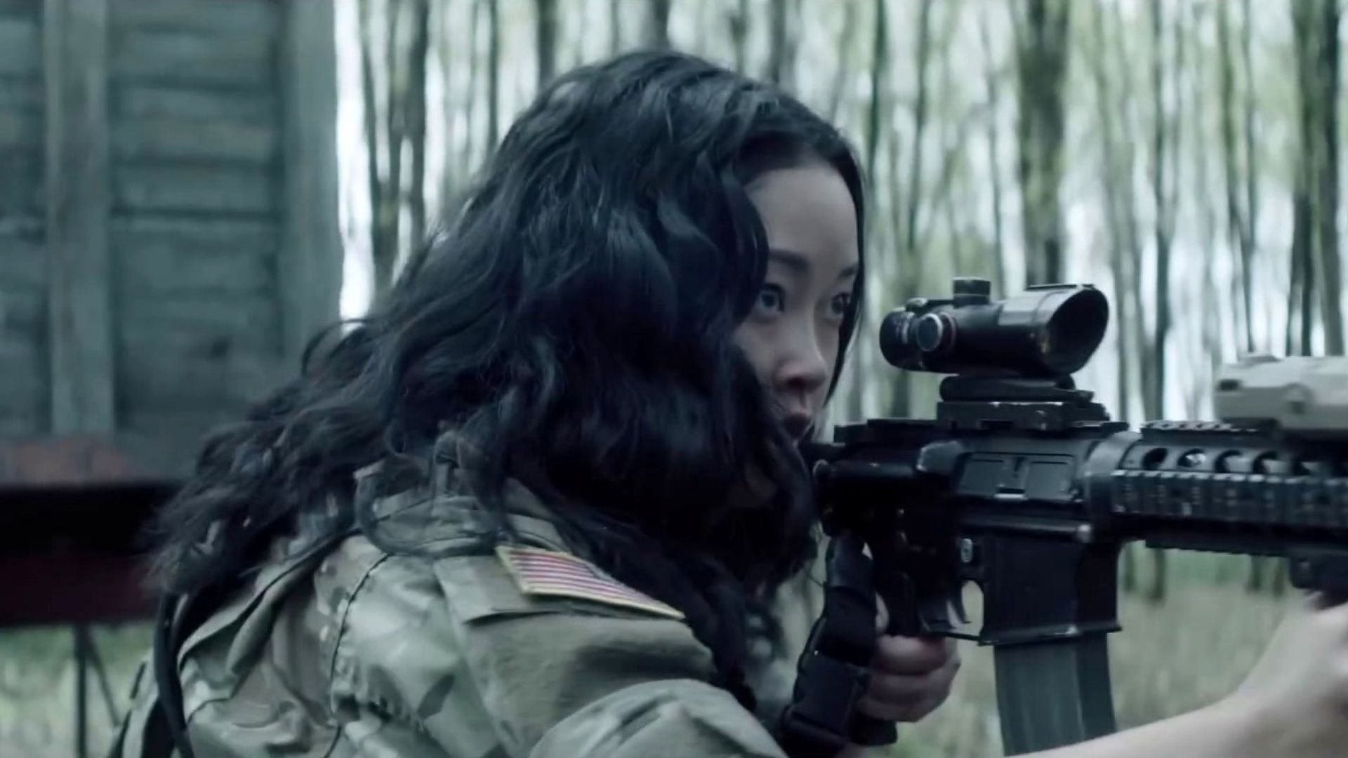 Lana Condor in Valiant One firing a rifle