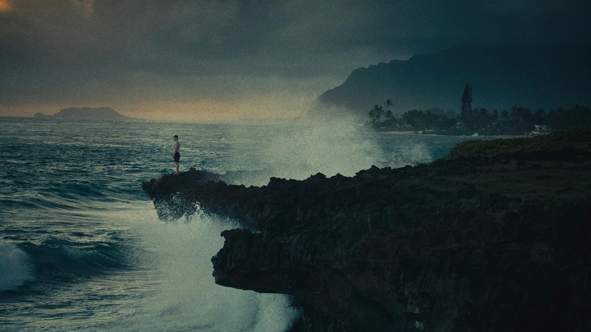 A boy on the rocky shore in the movie Reeling