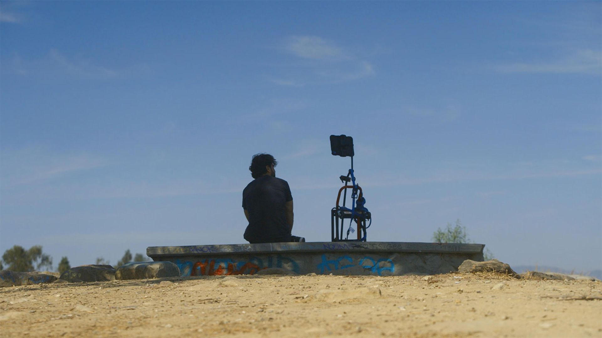 A man and a computer on the beach in Deepfaking Sam Altman