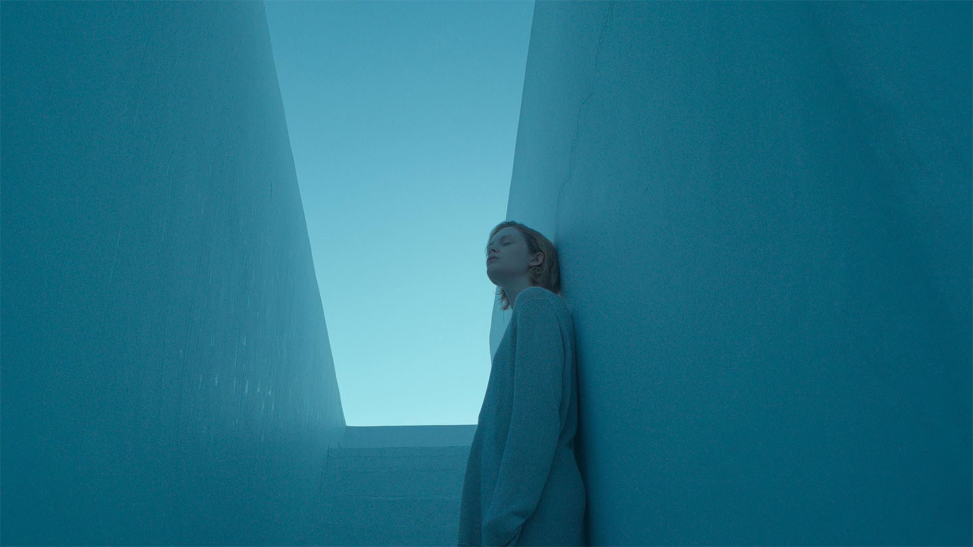 A woman in a blue by blue walls in the 2025 movie Satisfaction