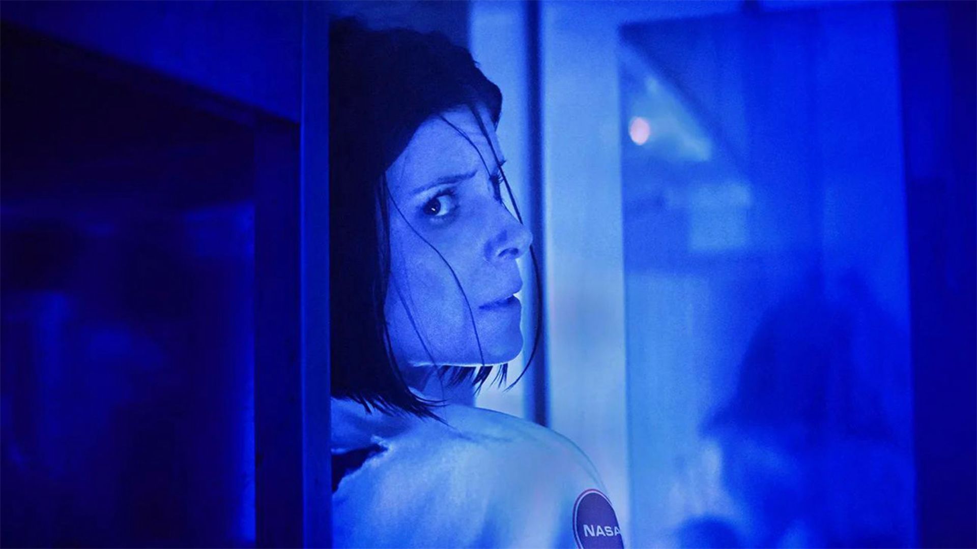 Kate Mara in blue light in The Astronaut