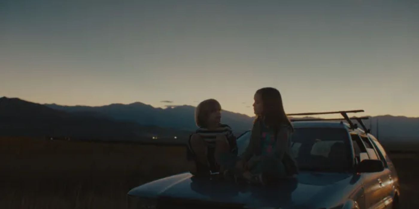 Kids sit on the roof of a car at sunset in the 2025 Sundance movie Omaha