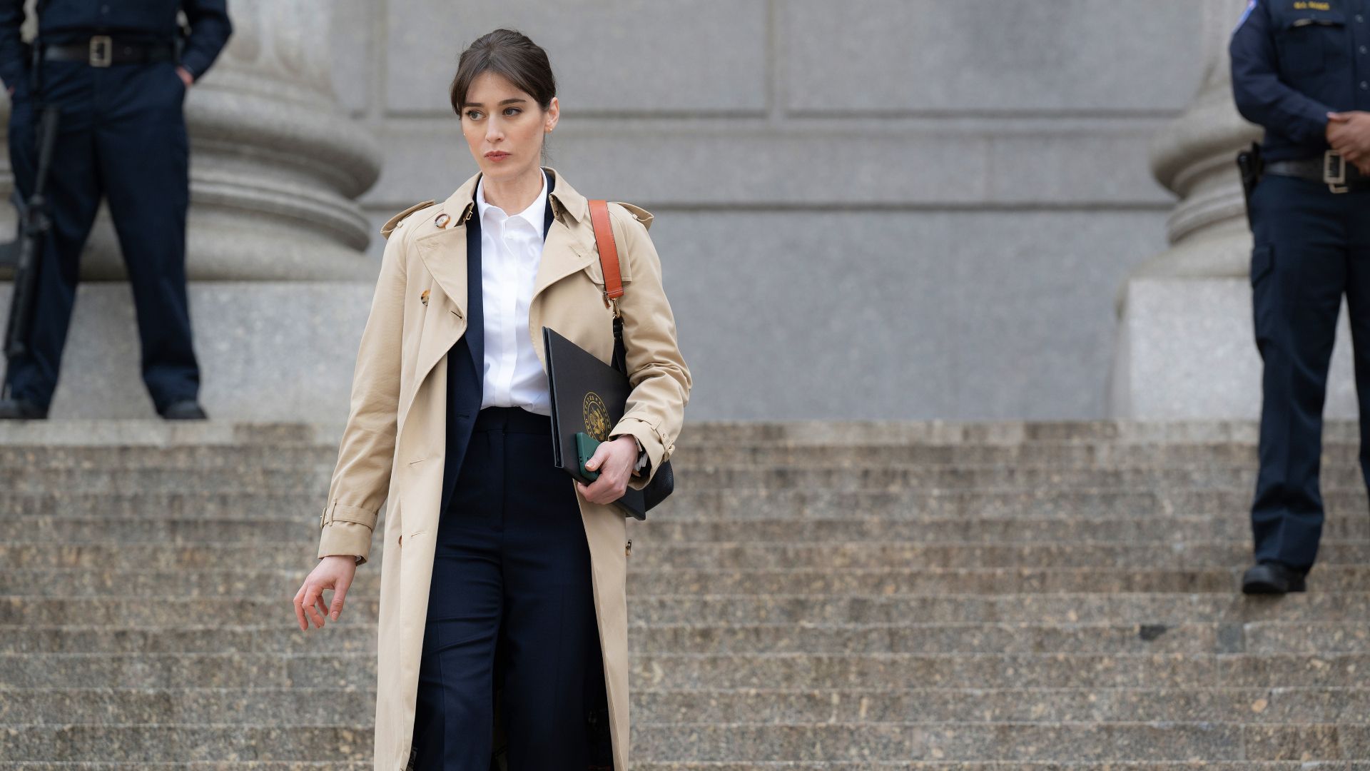 Lizzy Caplan walks down the Capitol stairs in the Netflix series Zero Day