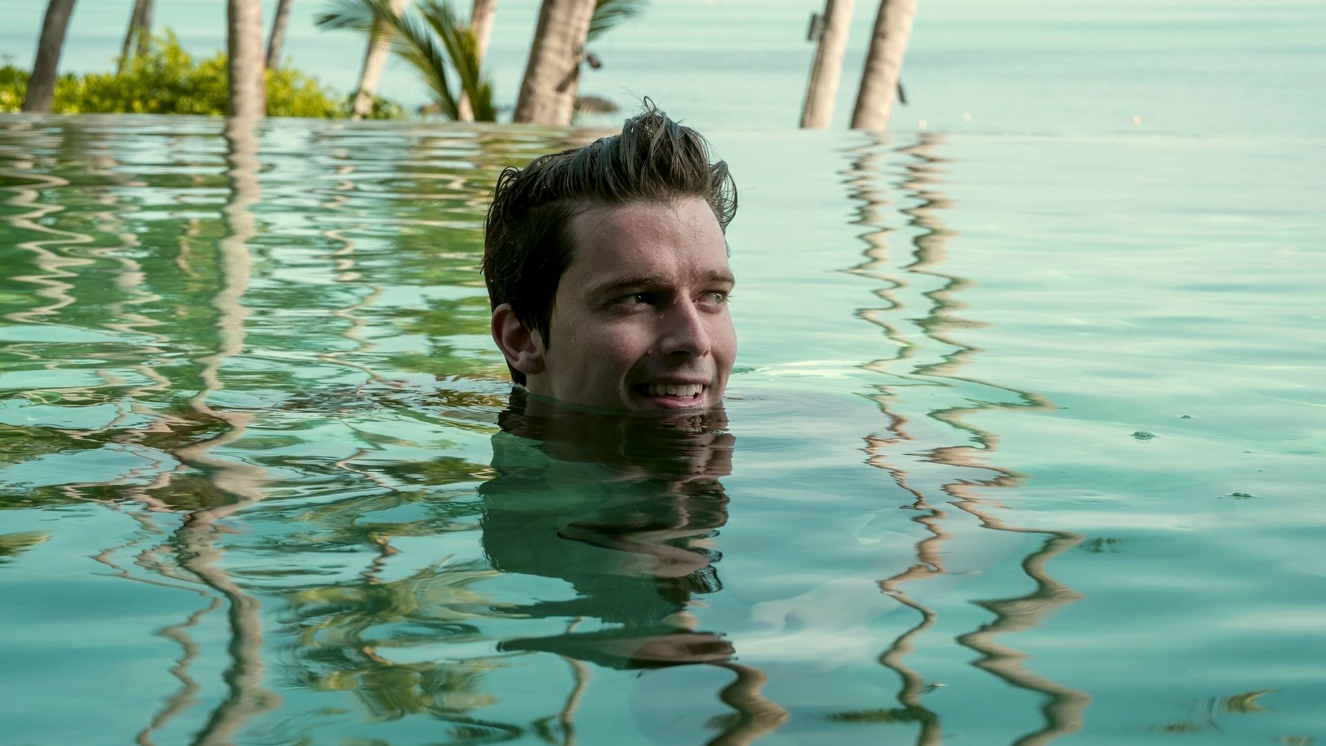 Patrick Schwarzenegger's head in the water in The White Lotus Season 3