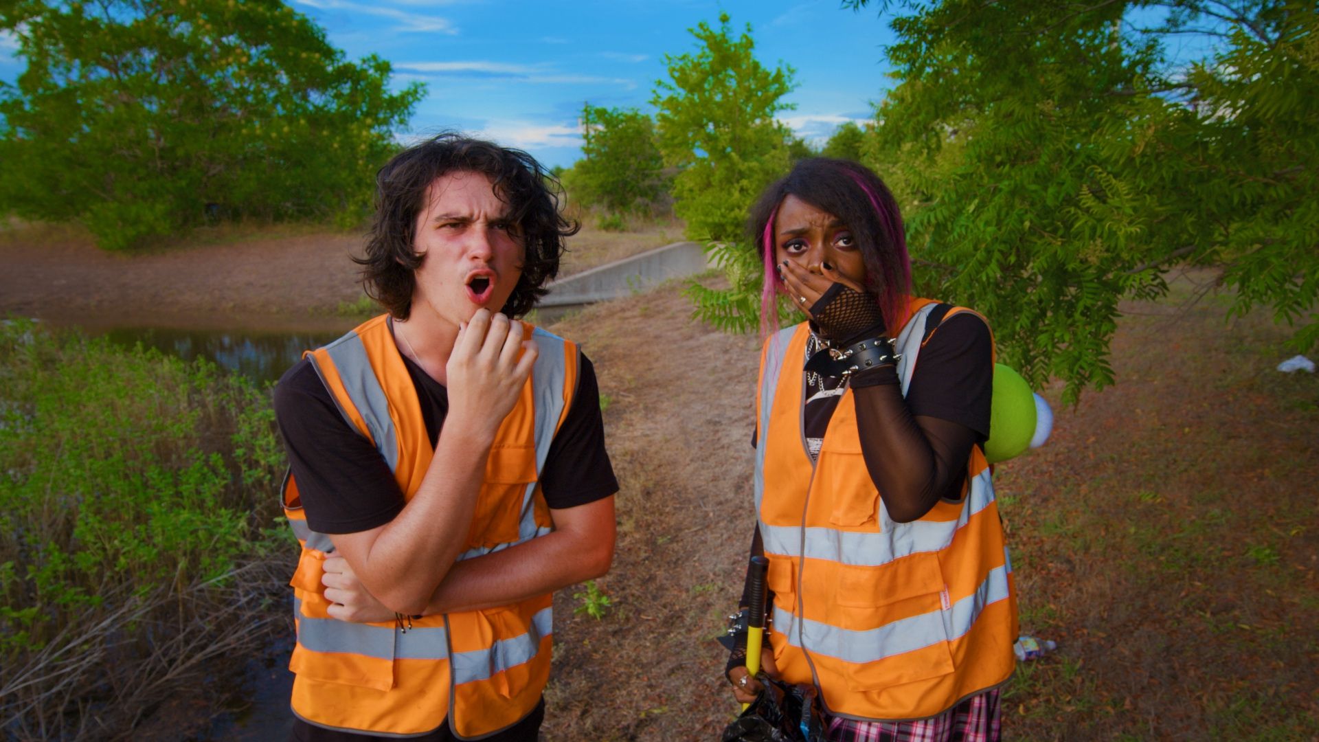 Luke Wilcox and his partner in a safety vest in the 2025 movie Rats!