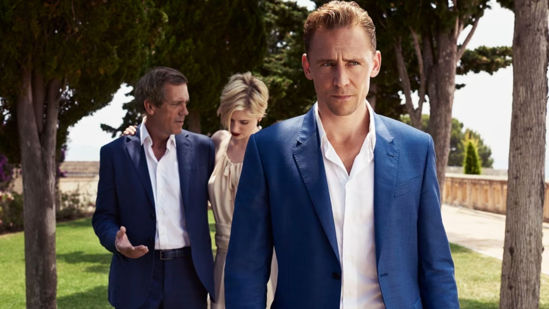 Pine walks before Dicky and Jed in The Night Manager