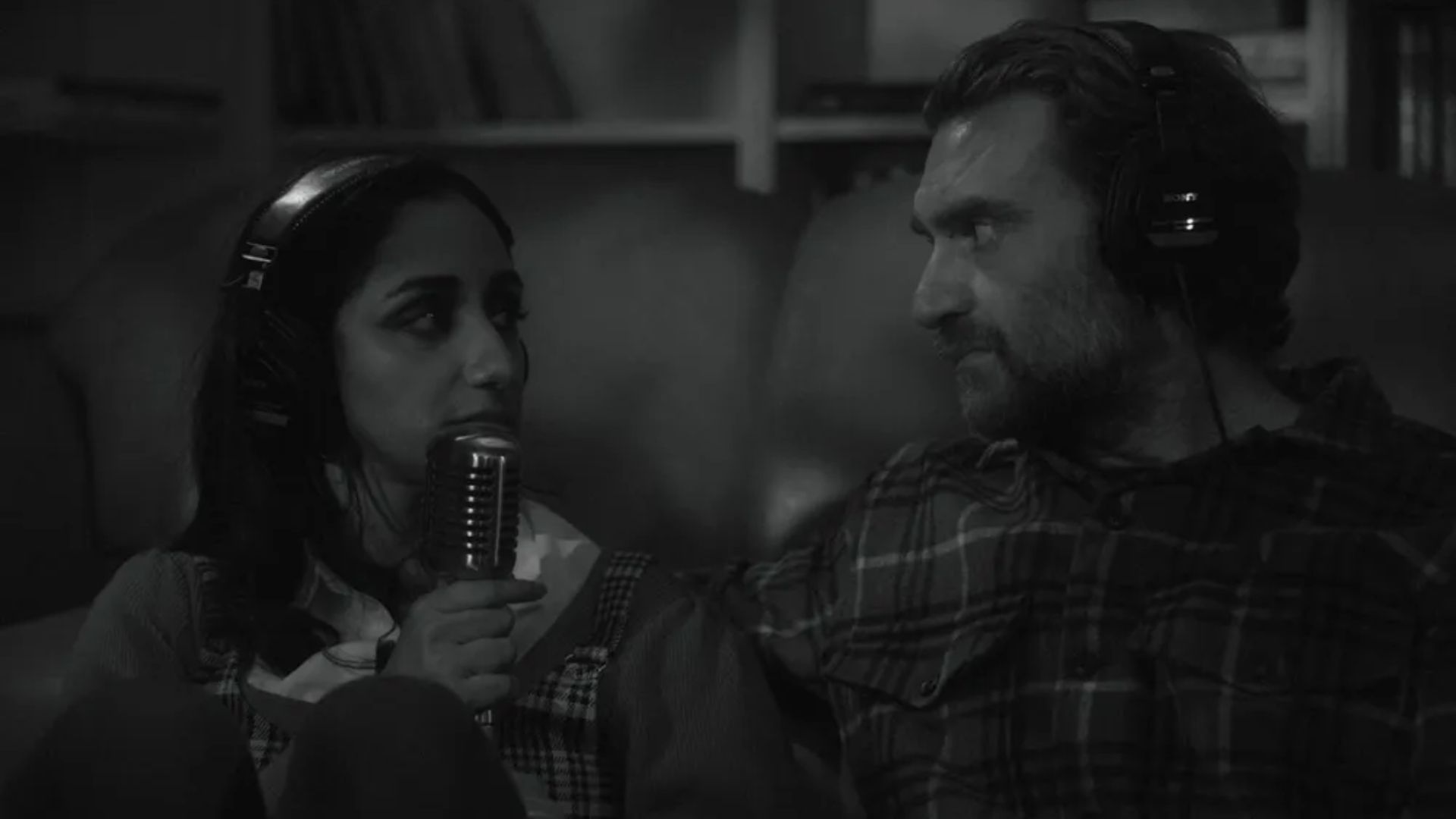 Vinita (Kiran Deol) with a microphone and her ex in the black and white Sundance 2025 movie Didn't Die