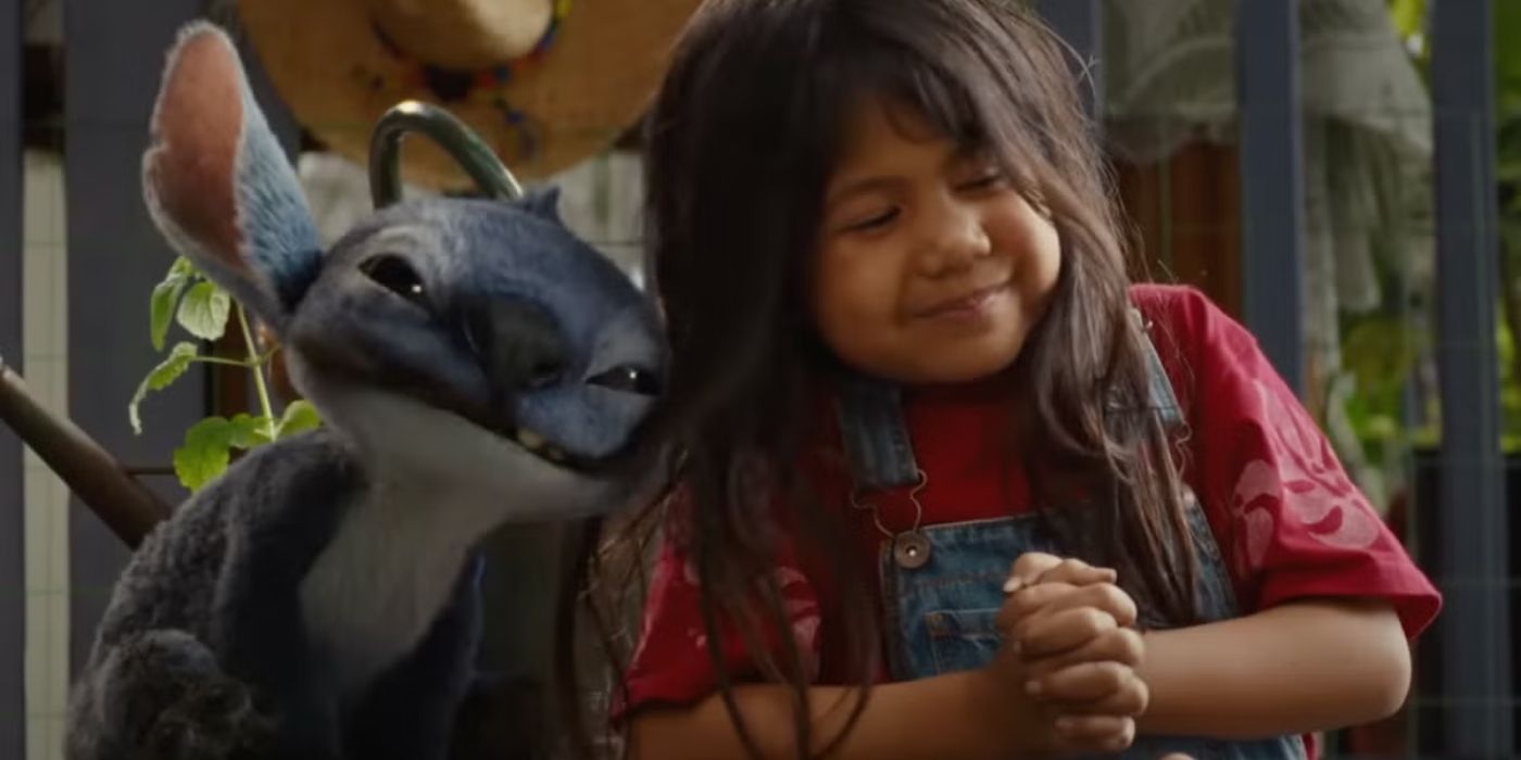Stitch next to a young girl in the Lilo & Stitch remake