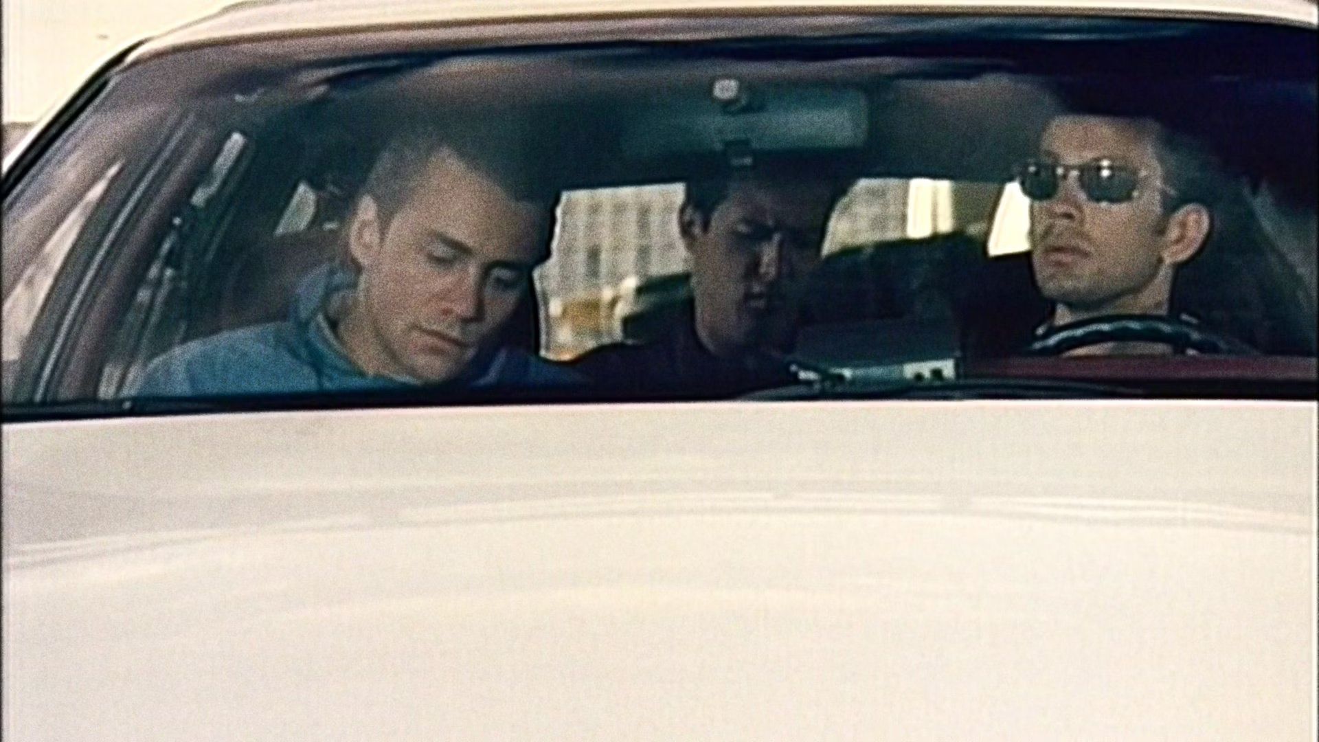 McLaren's gang sitting in the car before the bank robbery