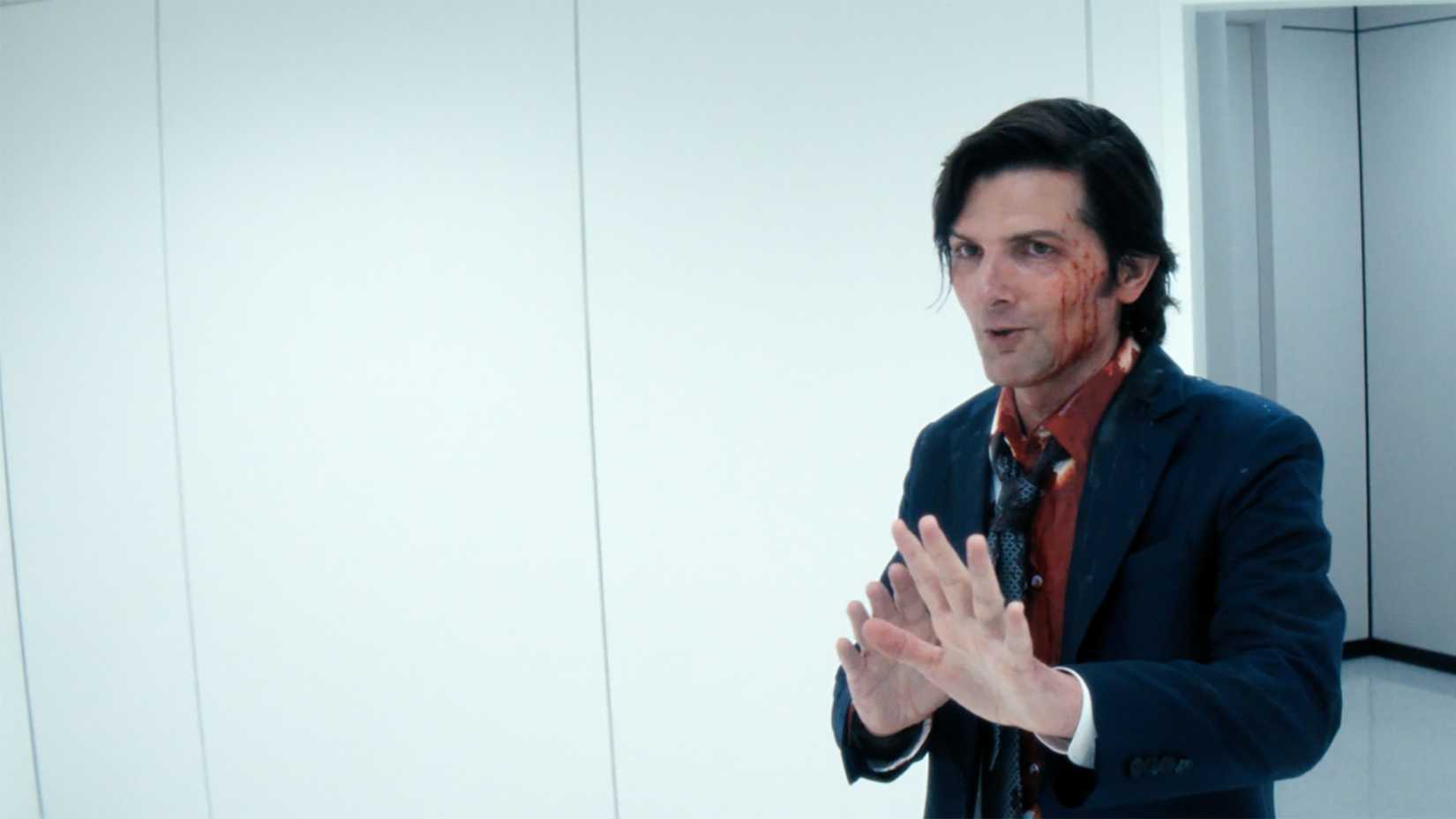 Mark bloody, cautiously approaching in Severance.