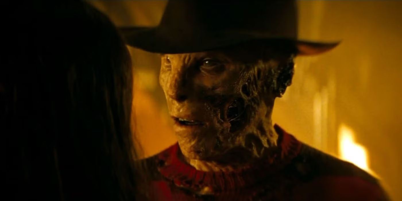 Jackie Earle Haley with a his fedora staring at Nancy  as Freddy Krueger in A Nightmare on Elm Street