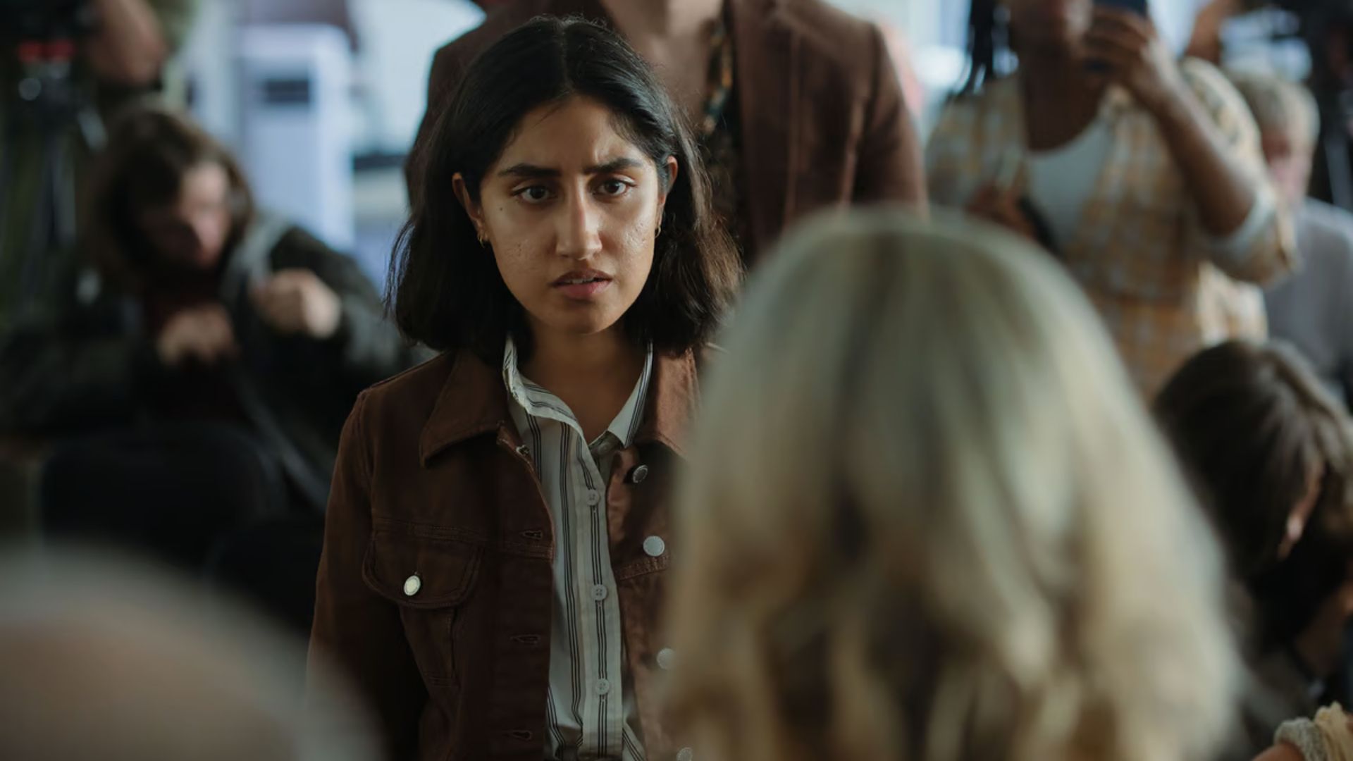 Selma stands in a crowd in The Stolen Girl