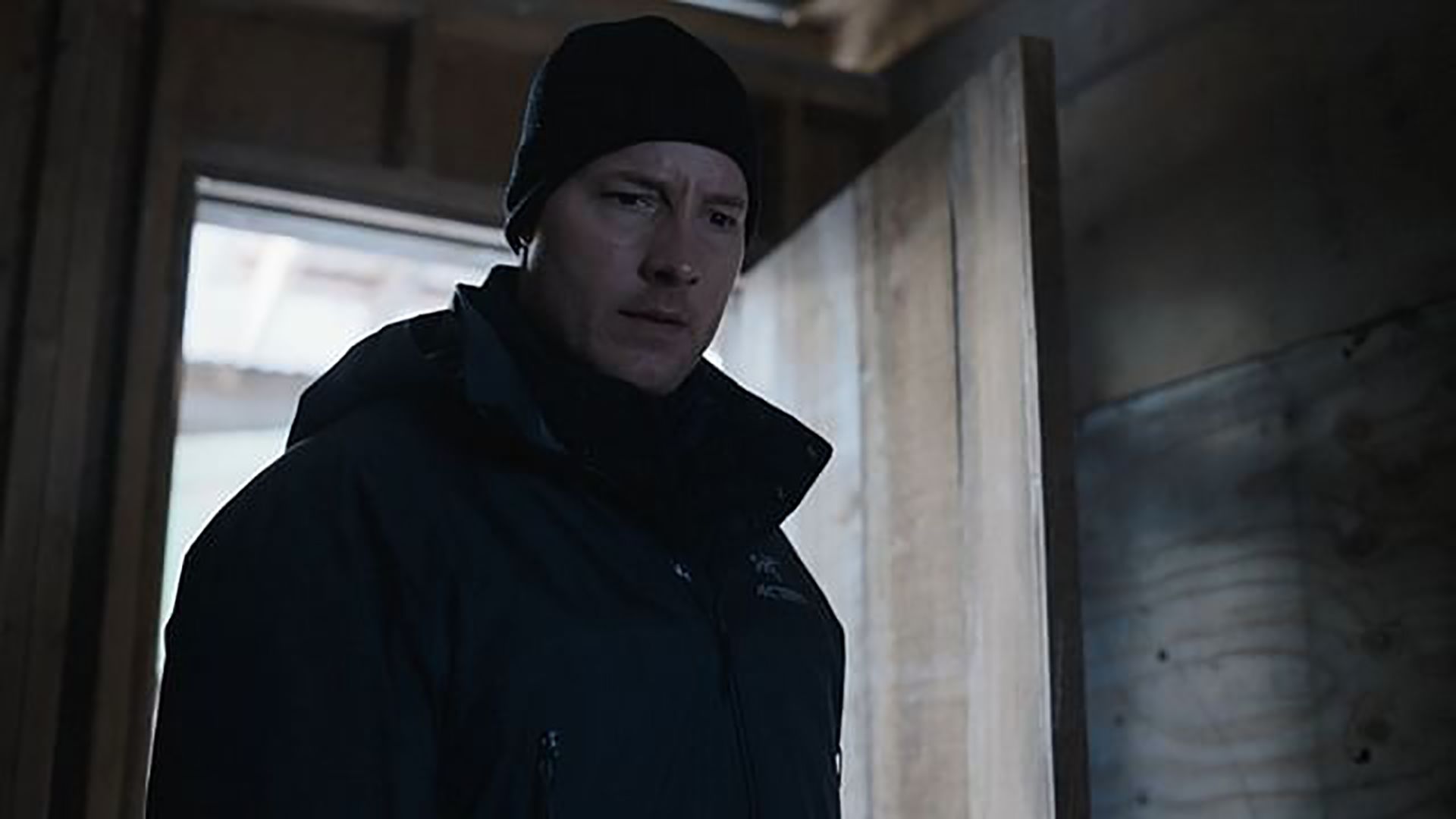 Colter in the cabin looking suspicious in Tracker
