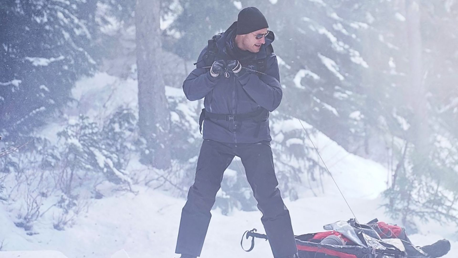 Colter dragging an injured Roger through the snow in Tracker
