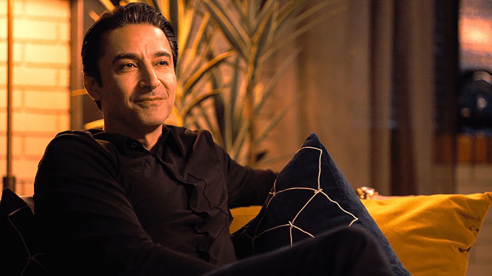 Leo sitting back in his chair looking arrogant in Tracker